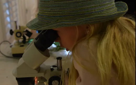 a person using a microscope