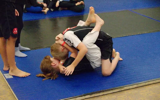 a man and woman wrestling