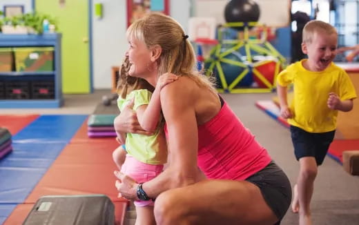 a woman holding a child