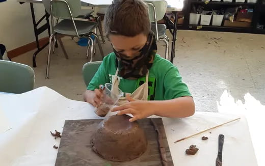 a young girl painting