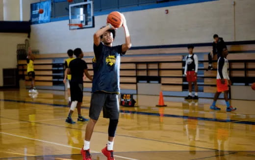 a person shooting a basketball