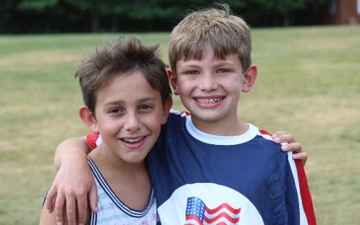 two boys in sports uniforms