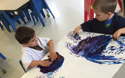 a few young boys painting